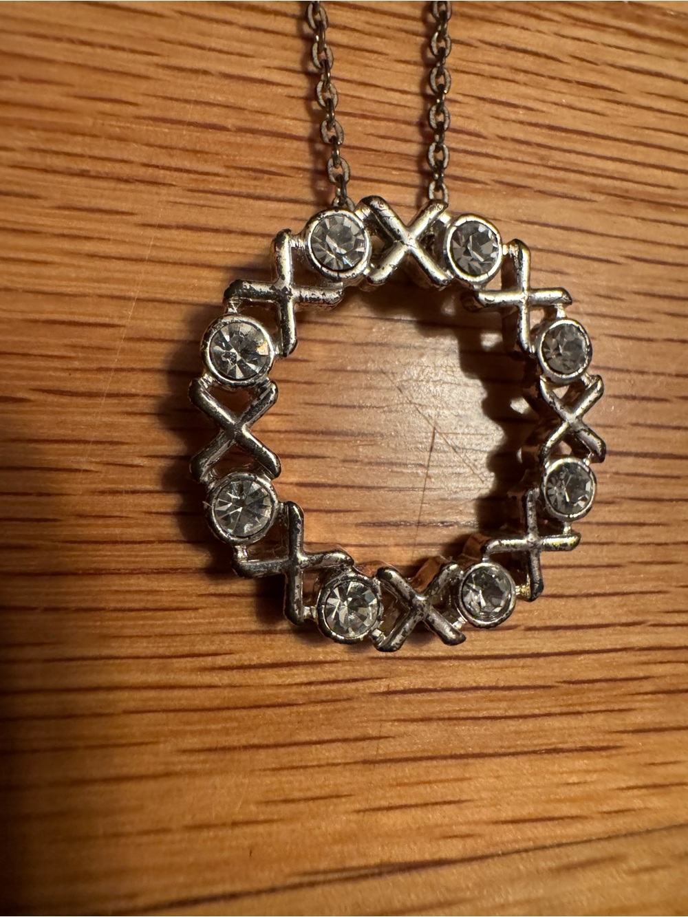 Silver-tone Crystal 'XOXO' Circle Pendant Necklace - Silver